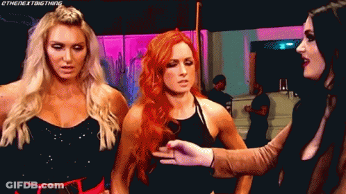 Three Women Are Standing Next To Each Other And One Of Them Is Wearing A Black Top GIF