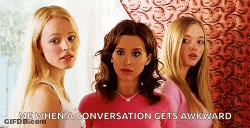 Three Women Are Standing Next To Each Other And One Of Them Is Wearing A Pink Sweater . GIF