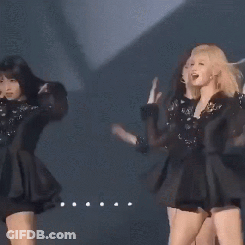 Three Women Are Standing Next To Each Other On A Stage In Black Dresses . GIF