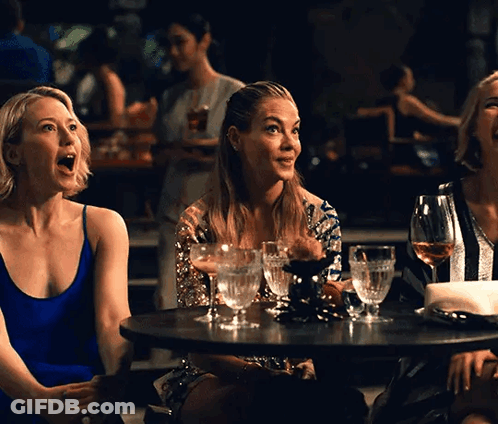 Three Women At Table With Wine GIF