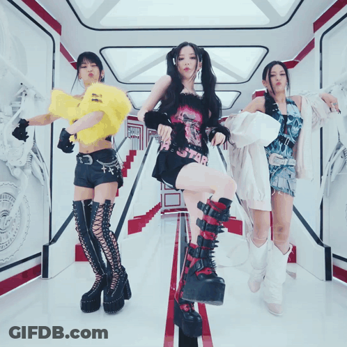 Three Women Dancing, One In Star Shirt GIF