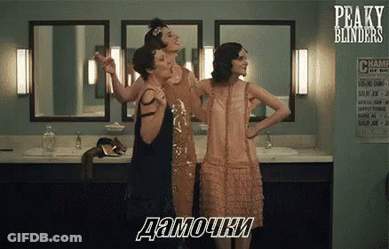 Three Women In Dresses Are Standing In A Bathroom . GIF