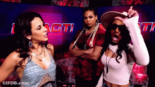 Three Women In Front Of Sign Saying I Act GIF