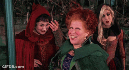 Three Women In Halloween Costumes Smiling GIF