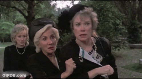Three Women In Park One Wearing Feather Hat GIF