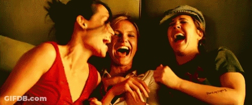Three Women Laughing One With Arm Tattoo GIF