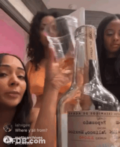 Three Women Next To Tequila Bottle GIF