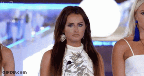 Three Women, One Wearing Earrings GIF