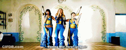 Three Women Singing In A Room With The Words Mamma Mia Here I Go Again Above Them GIF