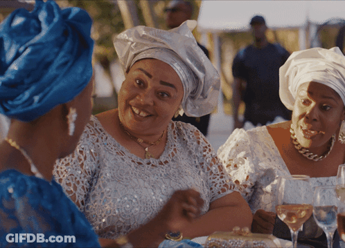 Three Women Sitting At Table With Wine Glasses GIF
