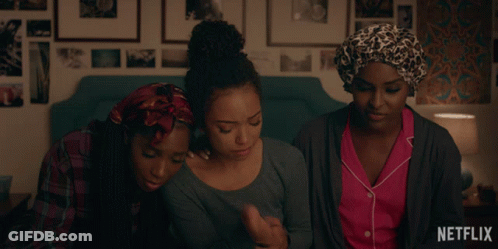 Three Women Sitting On Bed With Netflix Logo GIF