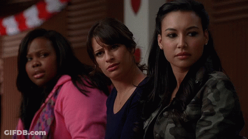 Three Women Sitting Together One In Pink Hoodie GIF