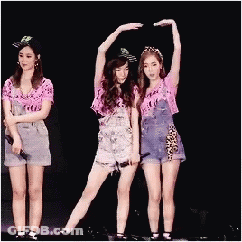 Three Women Stage Arms Up One Holding Mic GIF