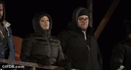 Three Women Standing In Dark Room GIF
