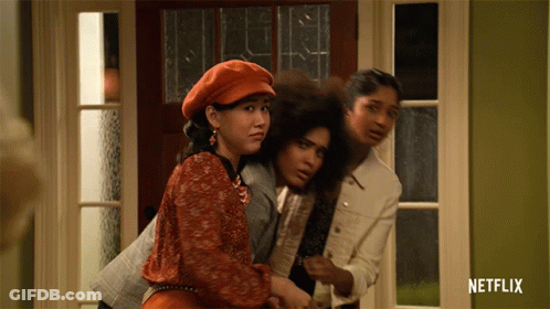 Three Women Standing In Front Of A Door With A Netflix Logo On The Bottom GIF