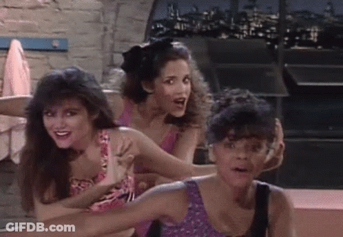 Three Women Standing Together One Holding Arm GIF