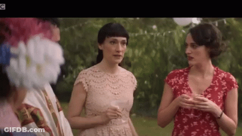 Three Women Talking With Wine Glasses In Park GIF