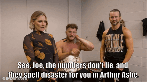 Three Wrestlers Are Standing In A Locker Room And One Of Them Is Wearing A Shirt That Says Double Threat GIF