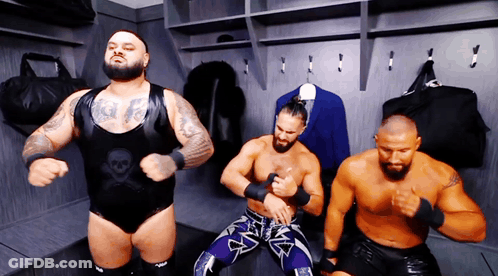 Three Wrestlers In Locker Room One With Skull Shirt GIF