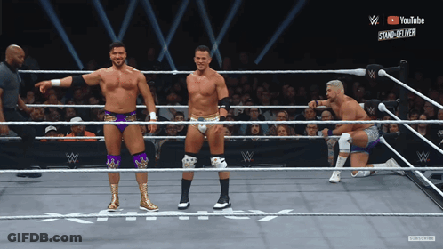 Three Wrestlers In Ring With YouTube Logo GIF