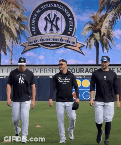 Three Yankees Baseball Players Are Walking In Front Of A George M. Steinbrenner Field Sign GIF