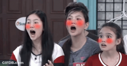 Three Young Girls With Red Painted Faces Open Mouths GIF