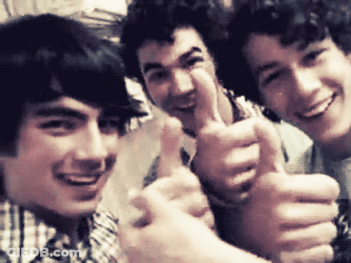 Three Young Men Are Giving A Thumbs Up And Smiling For The Camera GIF