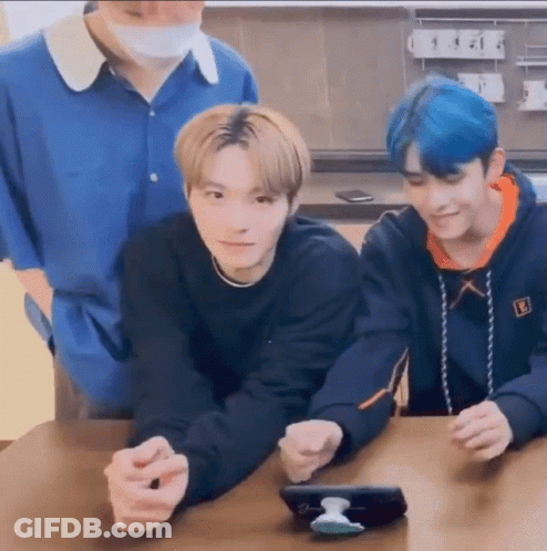 Three Young Men Looking At A Phone GIF