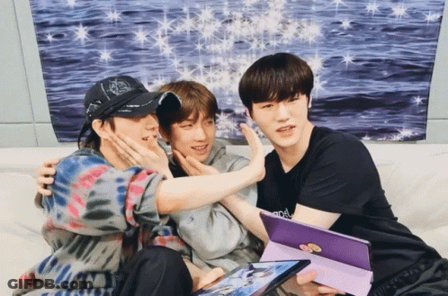 Three Young Men On Couch One Wearing Army Shirt GIF