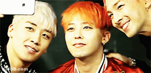 Three Young Men Posing For A Picture With One Of Them Having Red Hair GIF
