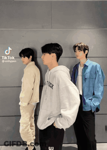Three Young Men Standing In Front Of A Wall With Tiktok Written On The Bottom Right GIF