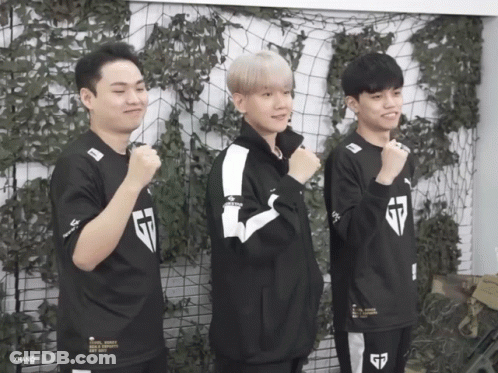 Three Young Men Wearing G7 Jerseys Stand In Front Of A Fence GIF
