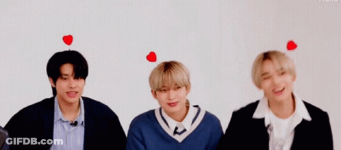 Three Young Men With Hearts On Heads GIF