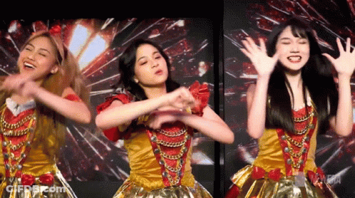 Three Young Women Dancing In Gold And Red Outfits GIF