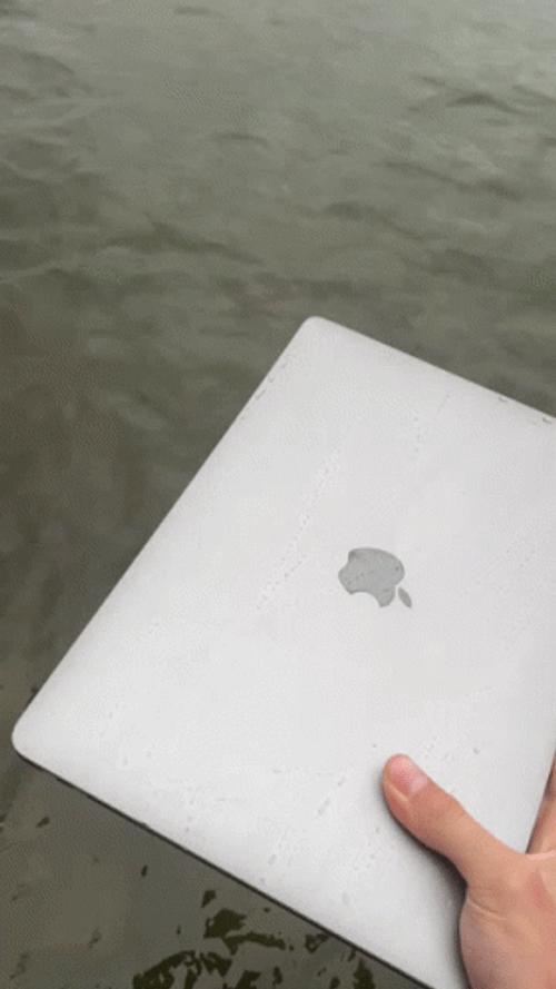 Throwing Computer Laptop On The Sea GIF