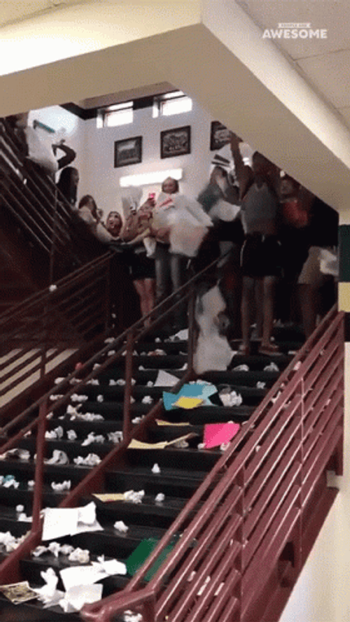 Throwing Papers At The Stairs GIF