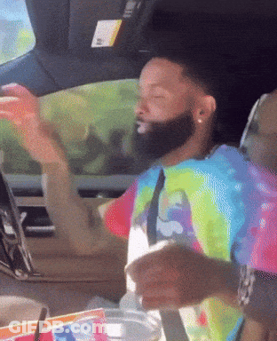 Tie Dye Shirt Man In Car With Arms Outstretched GIF