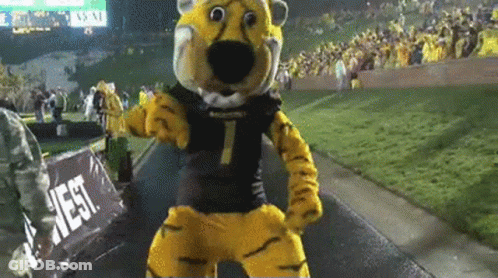 Tiger Mascot Dancing In Front Of West Sign GIF