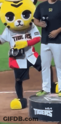 Tiger Mascot On Podium With Man Behind GIF