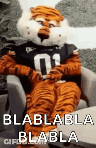 Tiger Mascot Sitting In Chair Saying Blablabla Blabla GIF