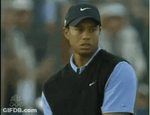 Tiger Woods Wearing Black Hat And Blue Shirt GIF