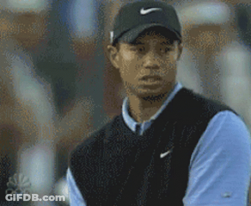 Tiger Woods Wearing Black Nike Hat And Blue Shirt GIF