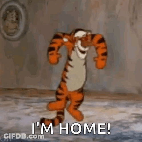 Tigger From Winnie The Pooh Is Dancing In A Room With The Words `` I 'M Home '' . GIF