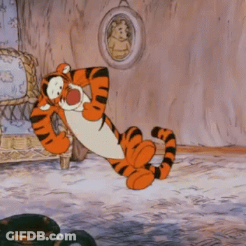 Tigger From Winnie The Pooh Is Sitting On The Floor GIF