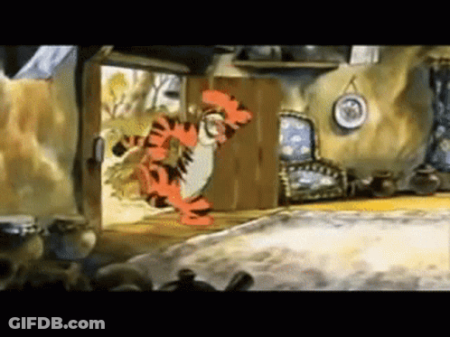 Tigger From Winnie The Pooh Is Standing In The Doorway Of A Room . GIF