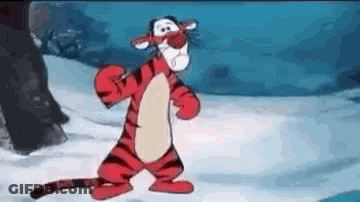 Tigger From Winnie The Pooh Is Standing In The Snow And Looking At The Camera . GIF