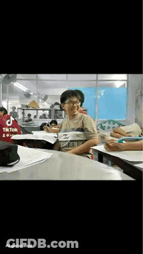 TikTok Man Sitting At Table With Papers GIF