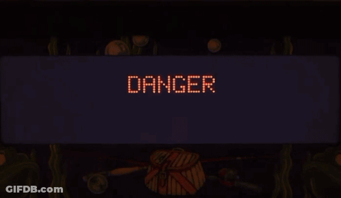 Tilt Sign Lit Up In Dark Room GIF