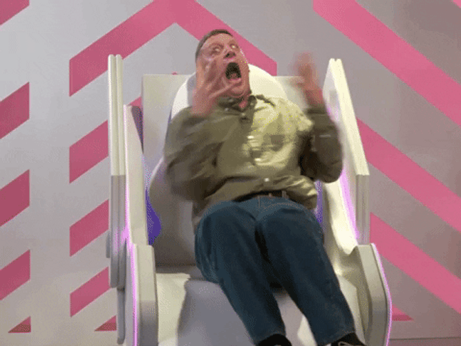 Tim Robinson Frantic Sitting On Chair Reaction GIF