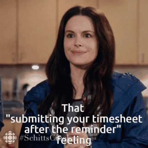Timesheet Emily Hampshire Awkward Smile GIF